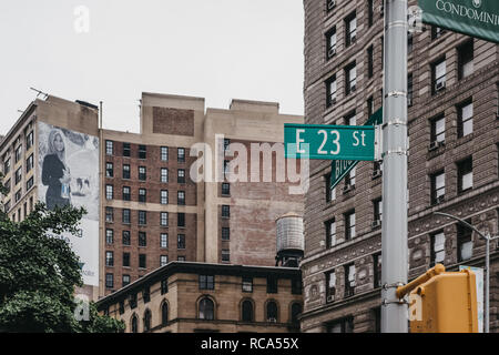 New York, USA - May 28, 2018: Street name and road signs on a lamp post on 23nd East Street in Manhattan, New York. New York is one of the most visite Stock Photo