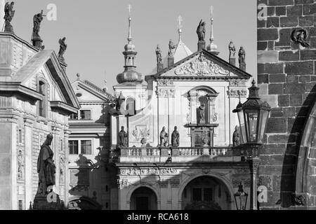 Praghe - The facade of St. Salvator church   and Křižovnické square from the Charles bridge. Stock Photo