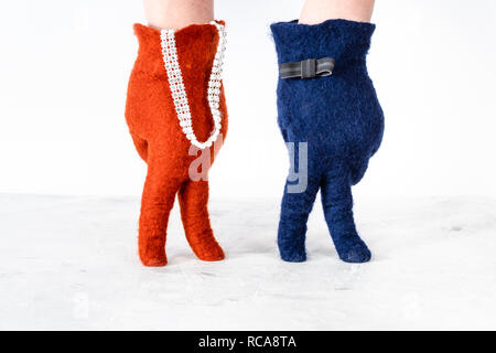 finger walking - hands in color felted gloves show standing couple on white background Stock Photo