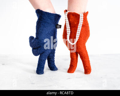 finger walking - hands in color felted gloves show speaking lady and gentleman on white background Stock Photo