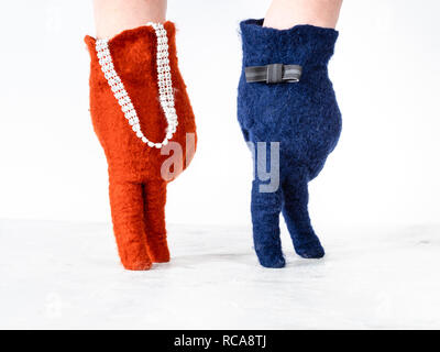 finger walking - hands in color felted gloves show standing lady and gentleman on white background Stock Photo
