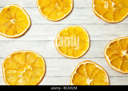 Orange slice on wood background, top view Stock Photo