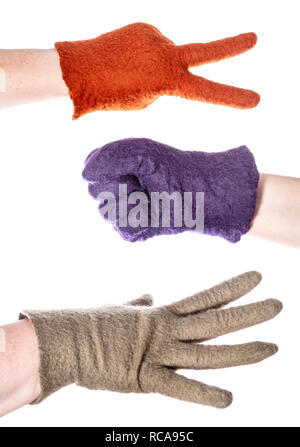 hands in colour gloves show elements of rock-paper-scissors game isolated on white background Stock Photo