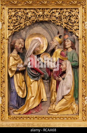 PRAGUE, CZECH REPUBLIC - OCTOBER 14, 2018: The gothic polychorme carved relief of Presentation of Jesus in the Temple in St. Vitus cathedral Stock Photo