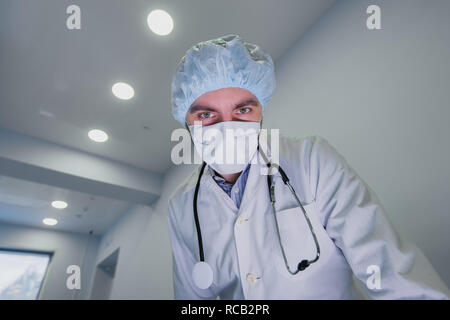 Surgeons looking down at patient getting ready for urgent surgery Stock ...