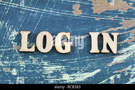 Log in written with wooden letters on rustic wooden surface Stock Photo