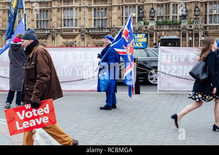 Westminster, London, UK. 15th Jan, 2019. A remain supporter looks on at a leave supporter outside parliament. Remain and leave protesters gather outside parliament in the morning ahead of the crucial vote in the House of Commons of the EU Withdrawal Bill. Credit: Tom Leighton/Alamy Live News Stock Photo