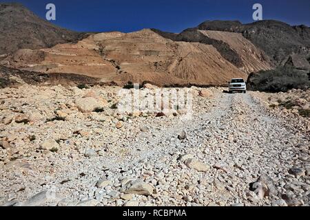 Travelling with a 4WD-vehicle in Wadi Afawl, landscape of the southern Dhofar, Jabal al-Qamar, Oman, Arabian Peninsula Stock Photo
