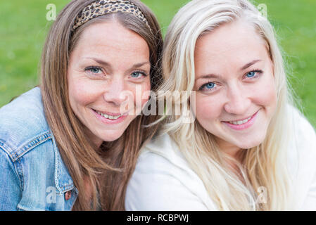Portrait of smiling young women Stock Photo