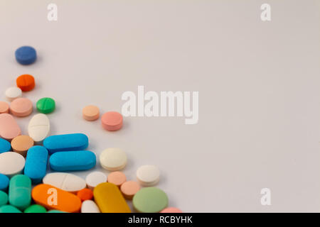 Pills of various colors. Medications for oral use. Drugs in the form of tablets. Stock Photo