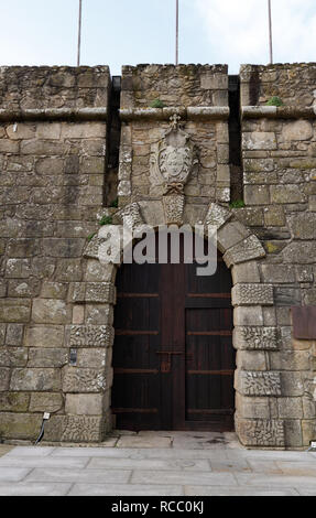 Old wooden browm door or the fort of St. John in Vila do Conde near Porto in Portugal, a military construction of the sixteenth century whose function Stock Photo