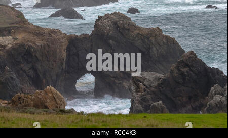 Beautiful keyhole rocks formations on the Pacific Ocean near Big Sur, California, in foggy day Stock Photo