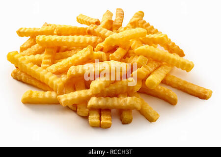 Heap of crispy golden crinkle cut potato chips or Pommes Frites on a white background for a menu Stock Photo