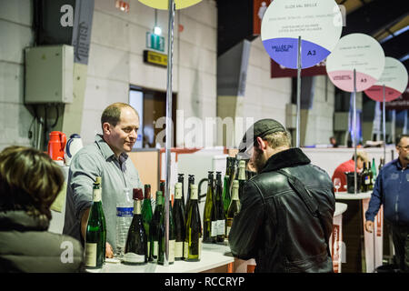 STRASBOURG, FRANCE - FEB 19, 2018: Man buying French wine at the Vignerons independant English: Independent winemakers of France wine fair in Strasbourg Stock Photo