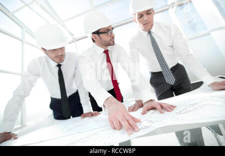 group of architects discussing sketches Stock Photo