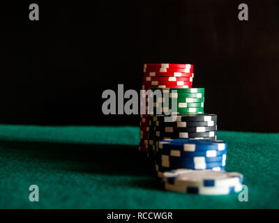 Several piles of poker chips of various colors Stock Photo