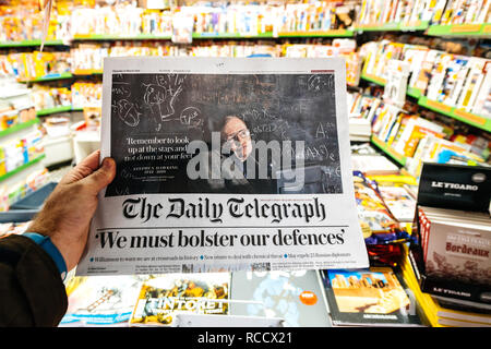 PARIS, FRANCE - MAR 15, 2018: International newspaper Daily Telegraph with portrait of Stephen Hawking the English theoretical physicist, cosmologist dead on 14 March 2018 Stock Photo
