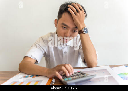 Young man thinking of financial solution Stock Photo