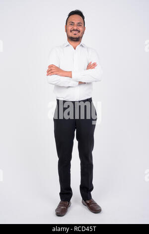 South Indian businessman standing with his arms crossed Stock Photo - Alamy