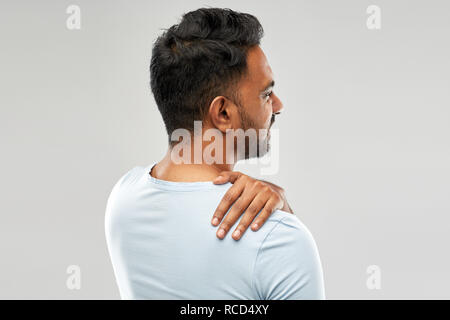 unhealthy indian man suffering from neck pain Stock Photo