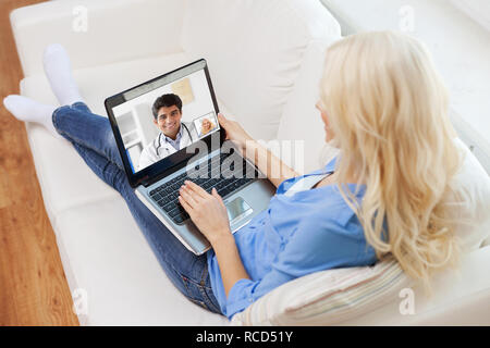 patient having video call with doctor on laptop Stock Photo