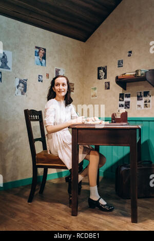 Amsterdam, Netherlands - September 5, 2017: Anne Frank figure in Madame Tussauds Wax Museum. Madame Tussauds Museum is one of the most popular attract Stock Photo