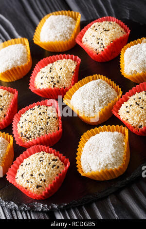 Daifukumochi, or Daifuku, is a Japanese confection consisting of a small round mochi stuffed with sweet filling. Vertical Stock Photo