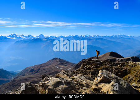 Woman hiking on the 3000m high Torrenthorn, Switzerland/Europe Stock Photo
