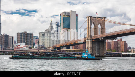 Cars pressed for recycling on transport boat, New York, Manhattan, East River Stock Photo