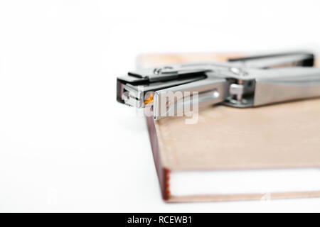 Diary with stapler. Isolated on the white background. Stock Photo