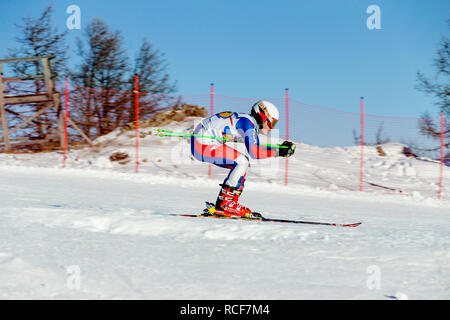 Magnitogorsk, Russia - December 18, 2018: men athlete racer in downhill skiing during National championship alpine skiing Stock Photo