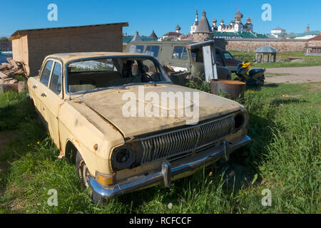 Old broken and abandoned car Volga on the Solovki island Stock Photo