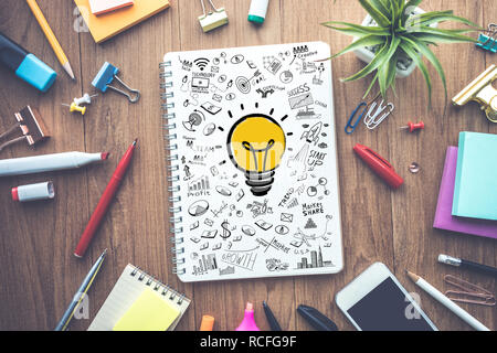 Business ideas creativity concepts with light bulb drawing on notepad Stock Photo