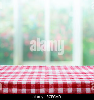 Checkered tablecloth texture top view on blur rose garden background.For montage product display or design key visual layout. Stock Photo