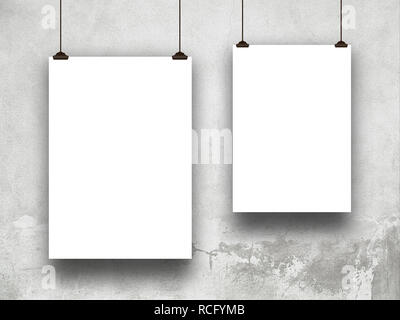 Two blank frames against gray concrete wall Stock Photo