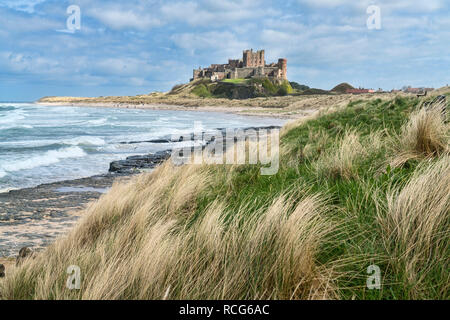 Looking along beach, coast to Bamburgh, Castle,  Northumberland, England, UK Stock Photo