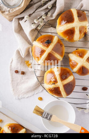 Traditional hot cross buns and ingredients for Easter. Stock Photo