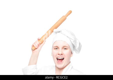 crazy cook with a rolling pin swings on white background, portrait isolated Stock Photo
