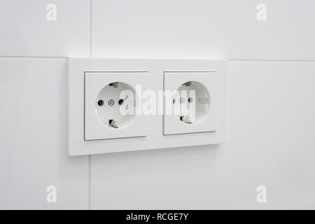 socket,  electric plug on white tiles Stock Photo