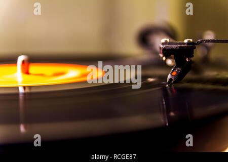 Vinyl lp record playing on a turntable isolated Stock Photo