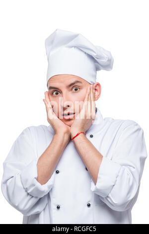 surprised and shocked chef, emotional male portrait on white background Stock Photo
