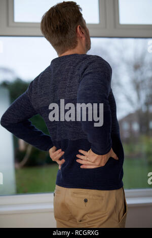 Man with back ache Stock Photo