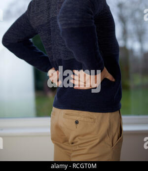 Man with back ache Stock Photo