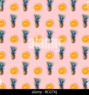 Pineapple and orange on pastel color background.Nature and holiday summer concepts. Stock Photo