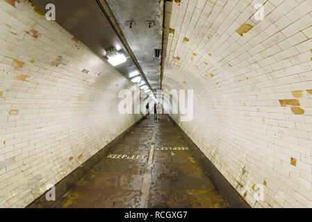 Greenwich foot tunnel in London, a pedestrian subway under the river Thames connecting the Isle of Dogs with Greenwich Cutty Sark. Stock Photo