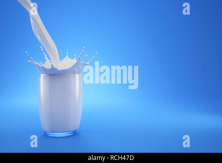 Milk pouring into a glass full of milk with crown splash. On blue background. With free space on a side to add text. Stock Photo