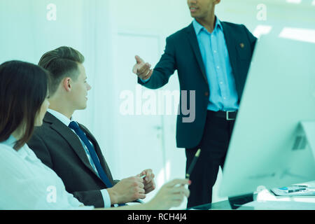 colleagues discussing new ideas in the office Stock Photo