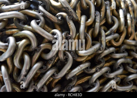 A metal chain bundled and locked to represent blockchain technology and its power and security Stock Photo