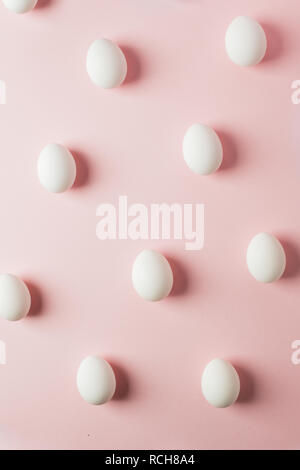 eggs pattern on pink pastel background, easter minimal concept Stock Photo