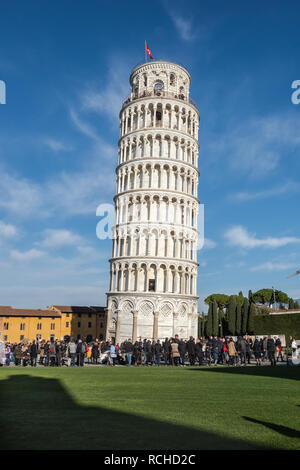 January 01, 2019 Pisa, Tuscany, Italy - Leaning Tower of Pisa in a sunny day with tourists in its grounds Stock Photo